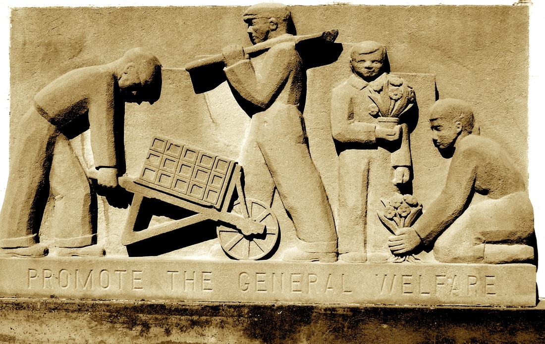 Stone carving of laborers with the text "Promote the General Welfare"